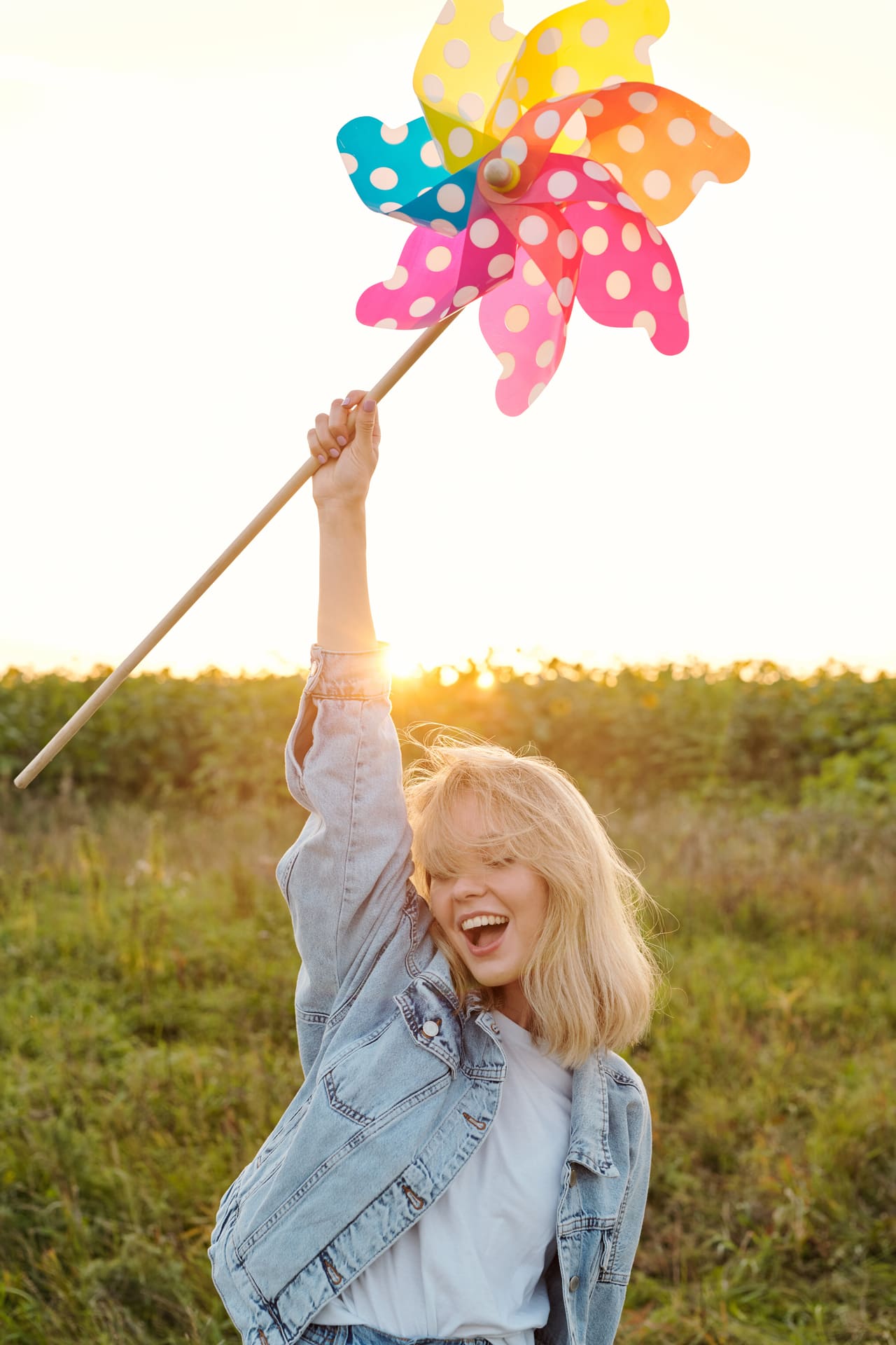 ecstatic girl in denim jacket and white tee holdin 2025 03 15 20 47 32 utc